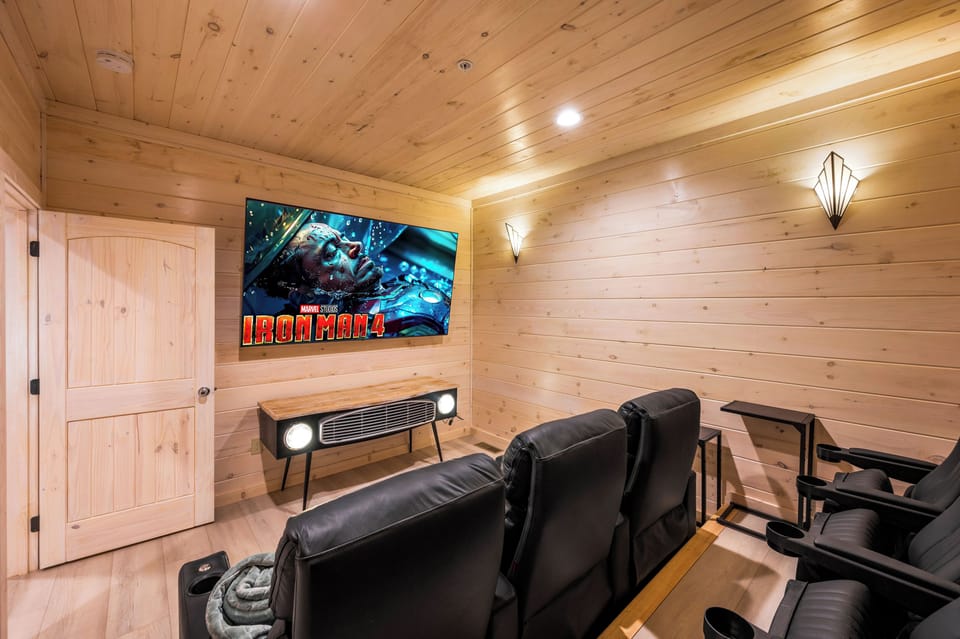 The family can enjoy a movie at this comfortable theater room