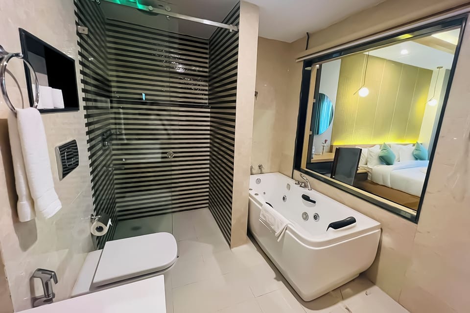 Executive Suite | Bathroom | Rainfall showerhead, hair dryer, bathrobes, slippers