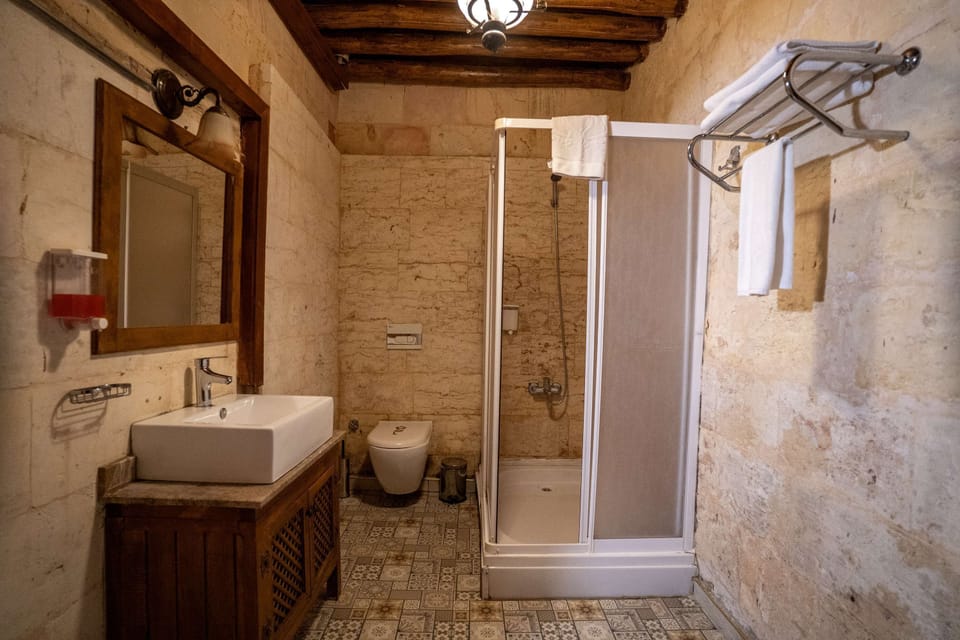 Standard Triple Room, Courtyard View | Bathroom | Shower, hair dryer, towels, soap