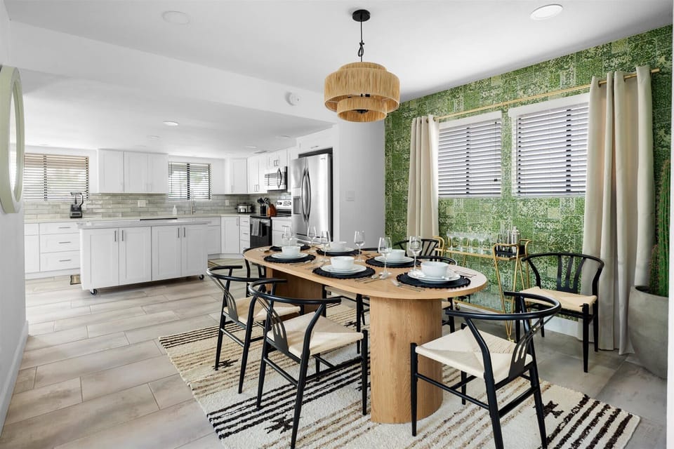 Experience the Beauty of Black Accents Against Warm Wood Tones in Our Dining Space