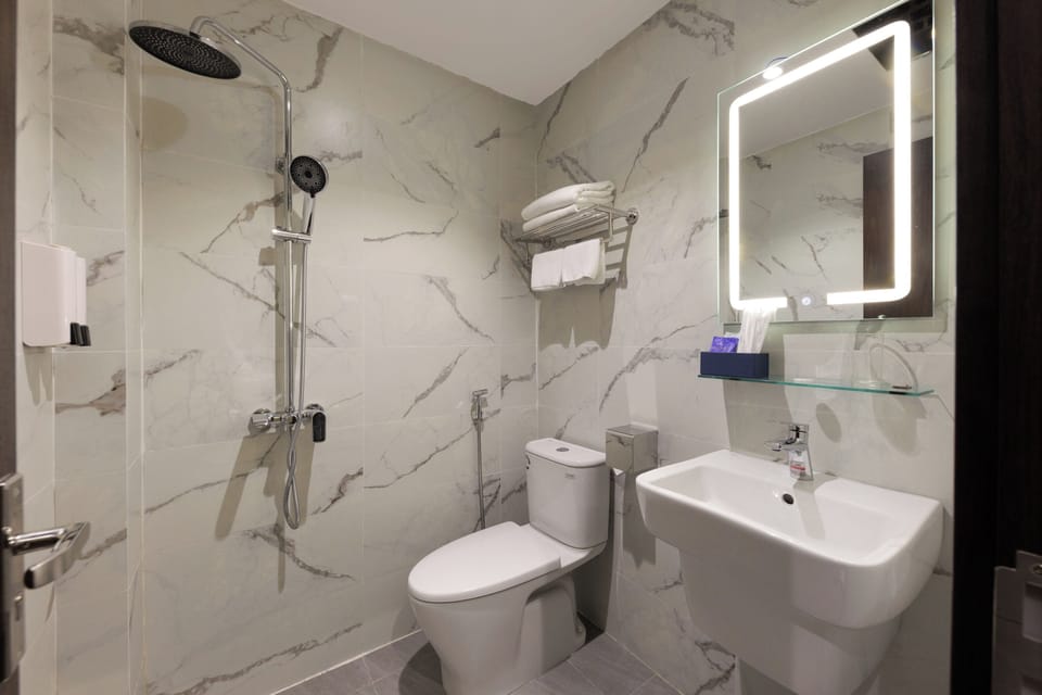 Shower, free toiletries, hair dryer, slippers