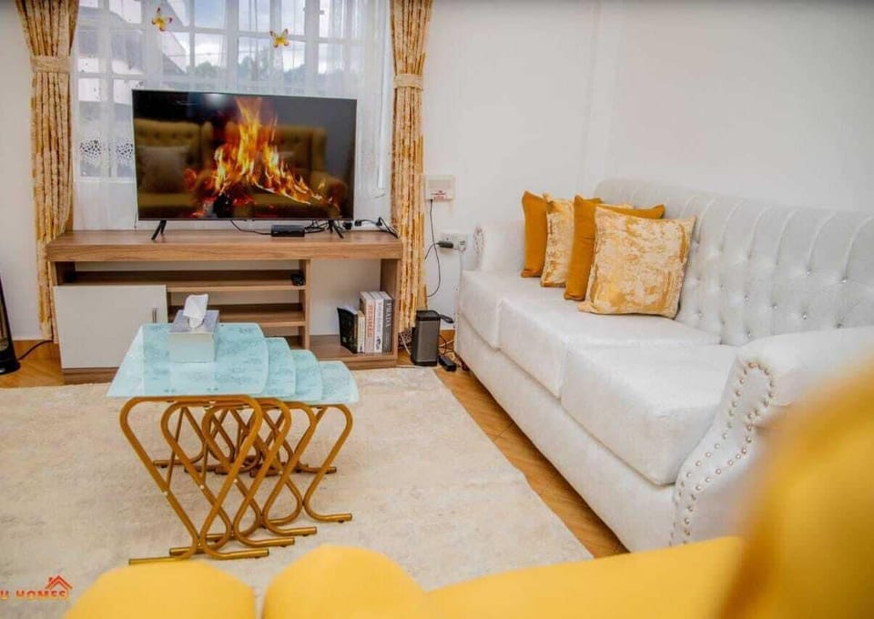 Comfort Apartment, City View | Living area | 24-inch Smart TV with digital channels