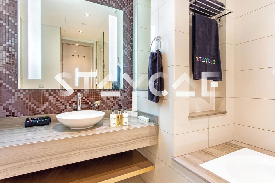 Basic Apartment | Bathroom | Separate tub and shower, free toiletries, hair dryer, bathrobes