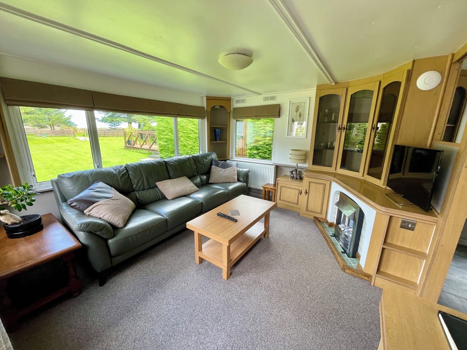 Standard House, 2 Bedrooms, Garden View | Living area | 32-inch flat-screen TV with digital channels, fireplace