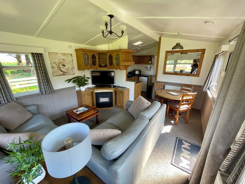 Standard House, 2 Bedrooms, Garden View | Living area | 32-inch flat-screen TV with digital channels, fireplace