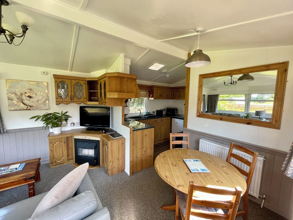 Standard House, 2 Bedrooms, Garden View | Living area | 32-inch flat-screen TV with digital channels, fireplace