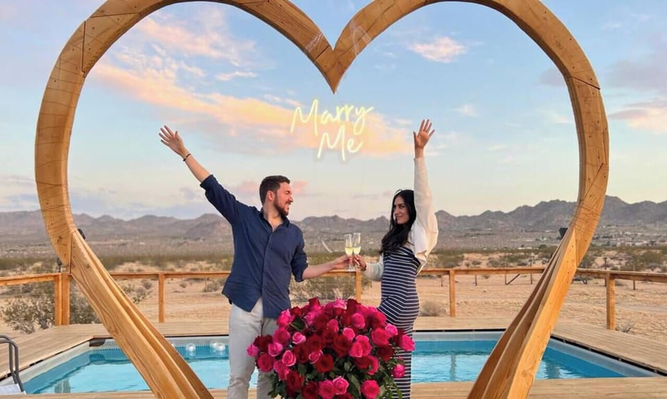 Our stunning desert heart arch sets th the perfect setting for a proposal she`ll never forget.e perfect scene for unforgettable proposals, complete with rose arrangements and poolside ambiance.