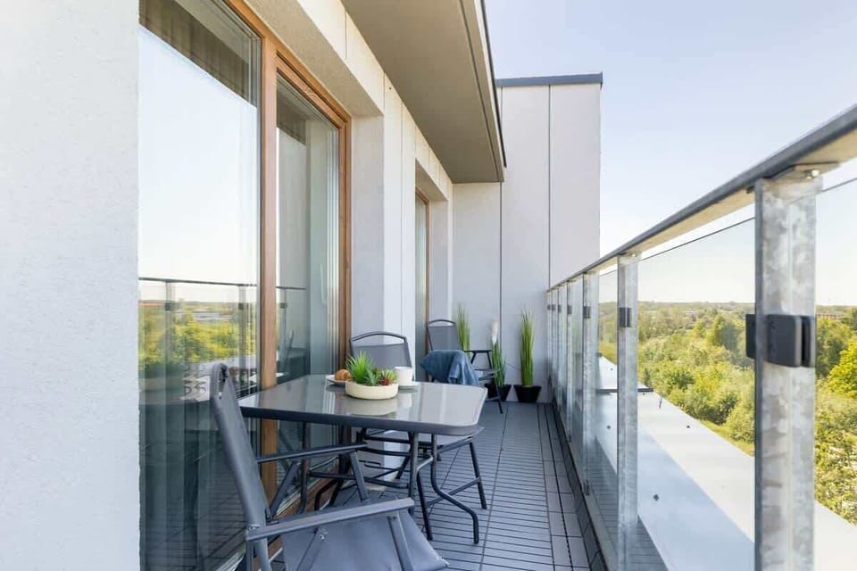The balcony provides a perfect spot for enjoying the fresh air. 