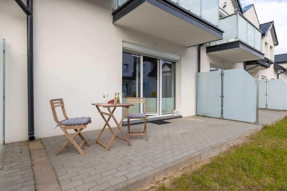 Furnished balcony with dining area.
