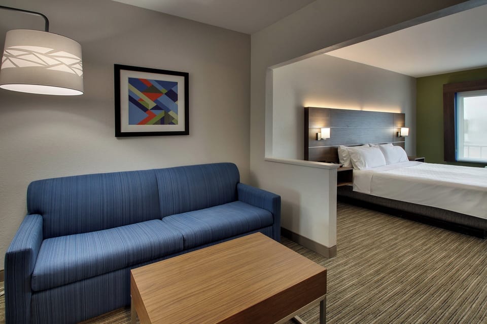 Suite, 1 King Bed (Additional Living Area) | In-room safe, desk, laptop workspace, blackout drapes