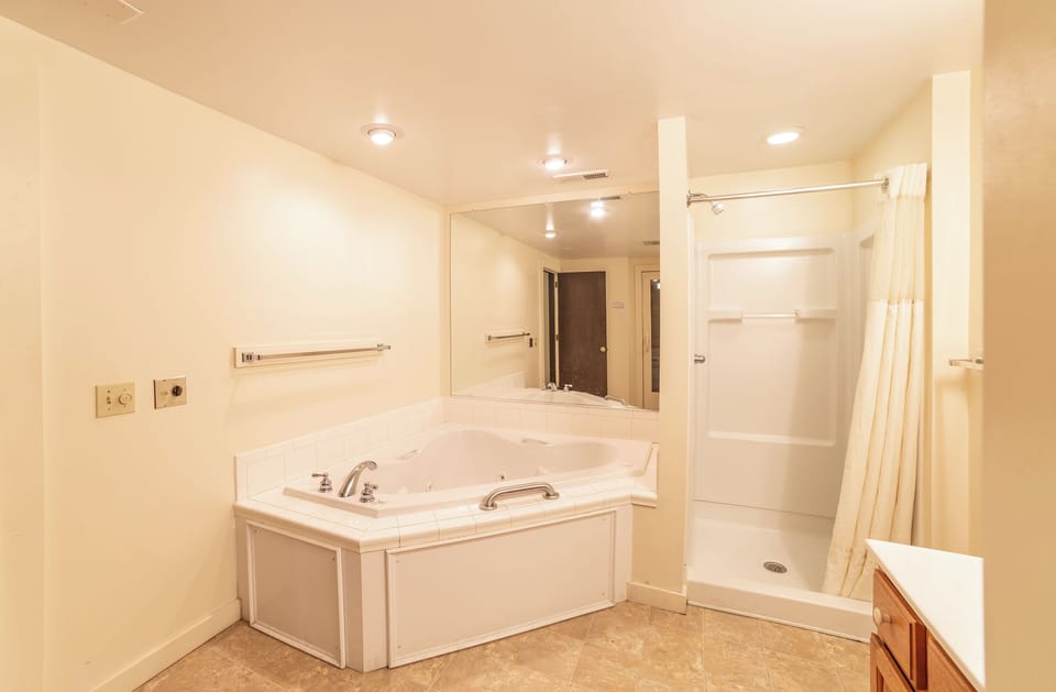 First level full bath with jetted tub, sauna and stand up shower