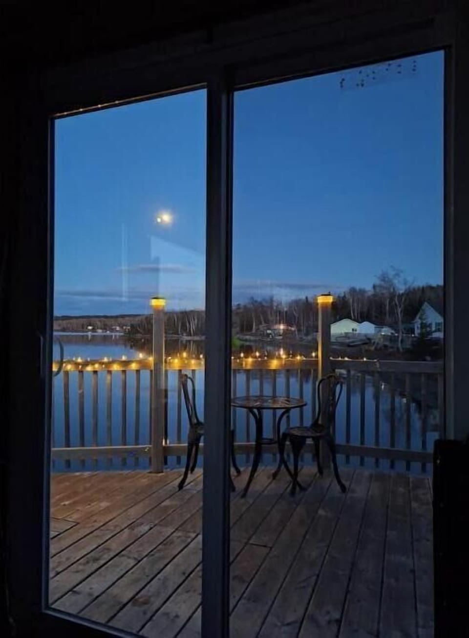 Your  beach view, from inside the cottage  patio door in the evening. 