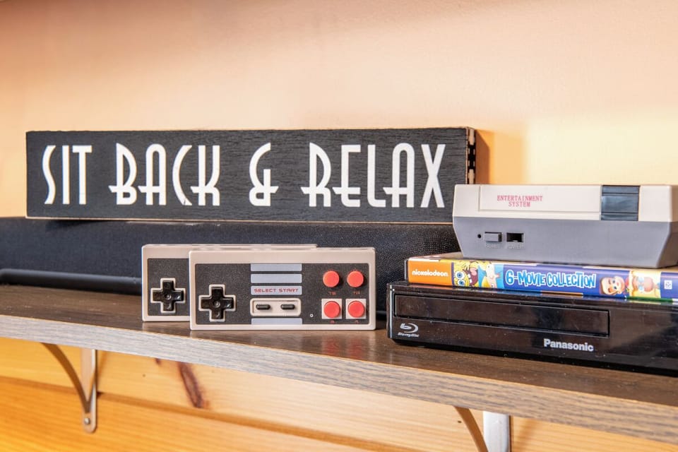 Kick back with classic gaming consoles and a Blu-ray player—your perfect setup for movie nights or nostalgic game sessions during your stay.