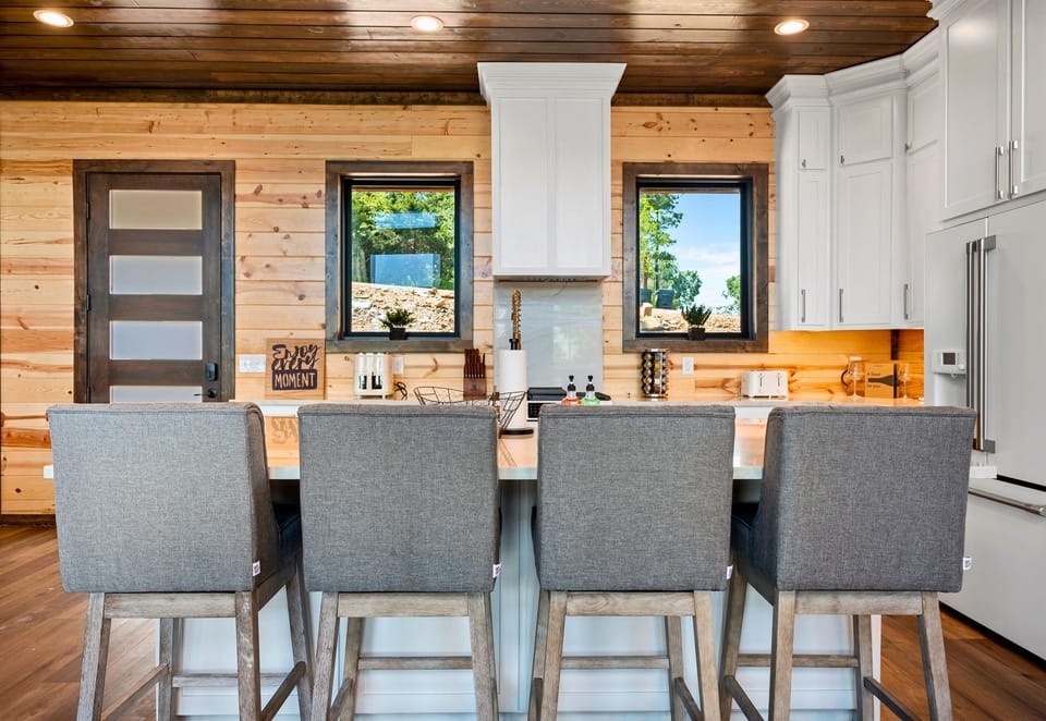 Gather around the island for snacks and great conversations in this well-equipped kitchen.