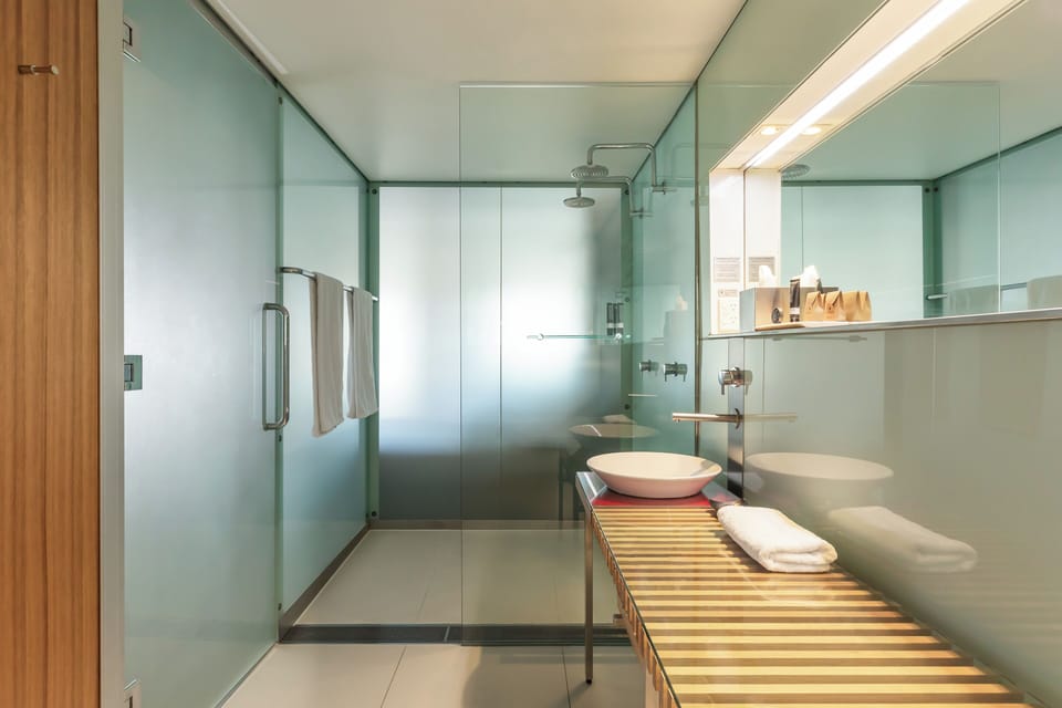 Standard Room - Harbour View | Bathroom | Shower, designer toiletries, hair dryer, bathrobes