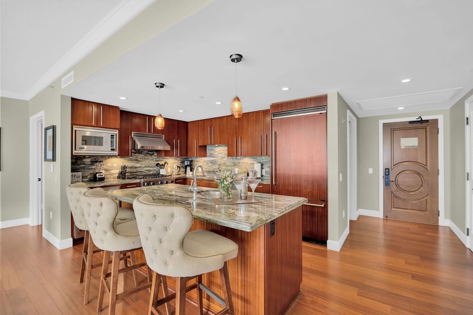 Gourmet kitchen with breakfast bar seating