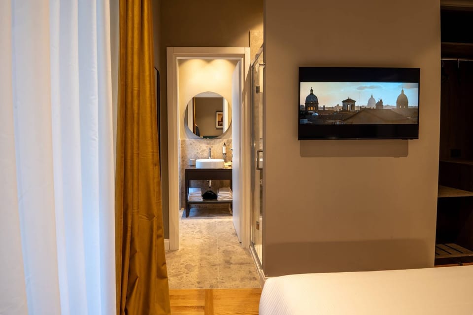 Deluxe Double Room, Garden View | Minibar, in-room safe, desk, laptop workspace