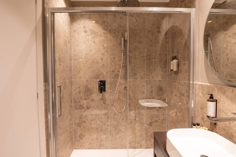 Deluxe Double Room, City View | Bathroom | Shower, hair dryer, slippers, bidet