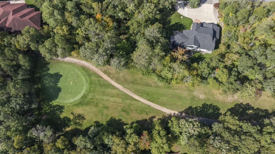 Property backs up to Breezy Point Traditional Golf Course