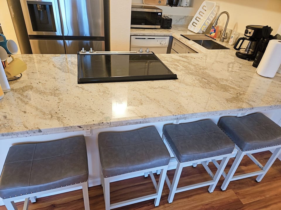 Kitchen with natural granite countertop, new cabinets and new appliances. 