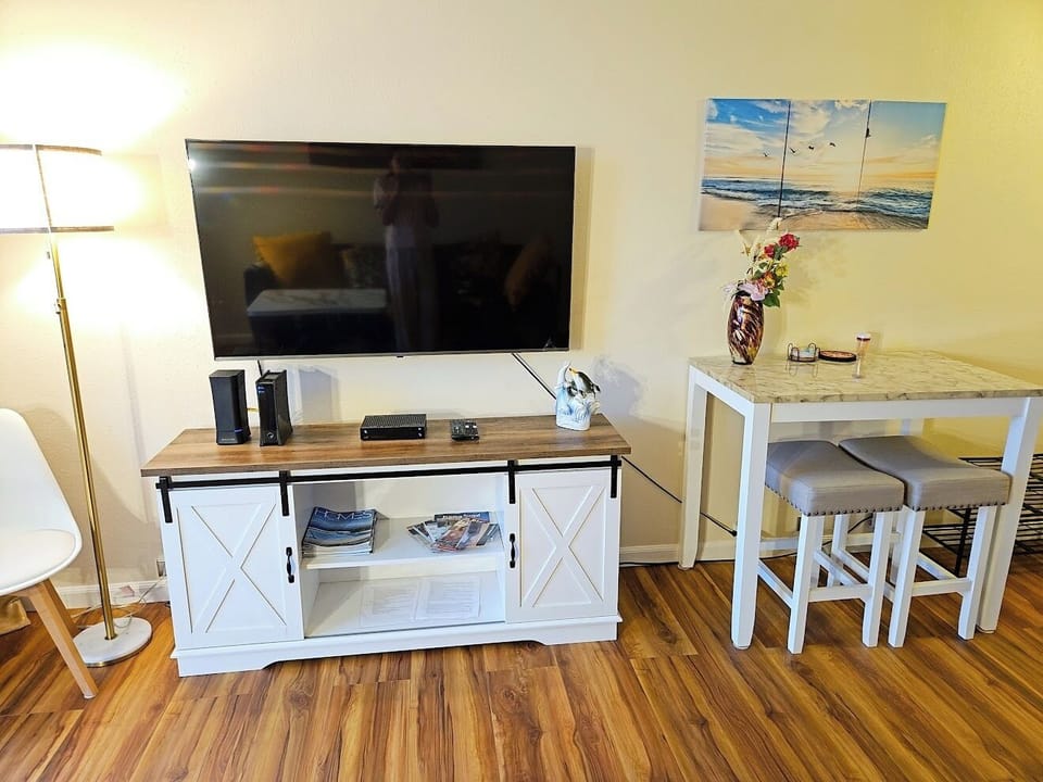 TV stand and dining table in the living room.