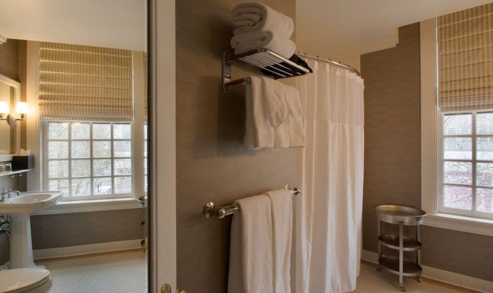 Enjoy a spacious shower in the well-appointed bathroom, designed with modern amenities and ample lighting.