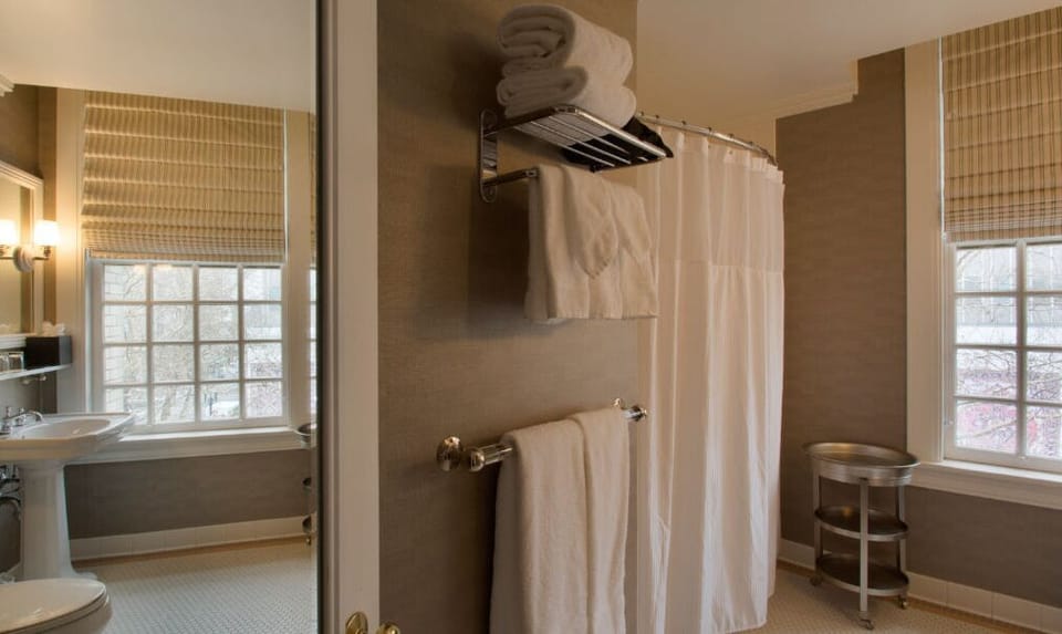 Enjoy a spacious shower in the well-appointed bathroom, designed with modern amenities and ample lighting.