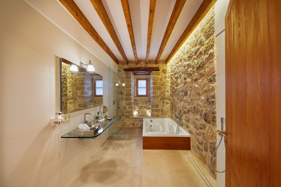 Separate tub and shower, designer toiletries, hair dryer, bathrobes