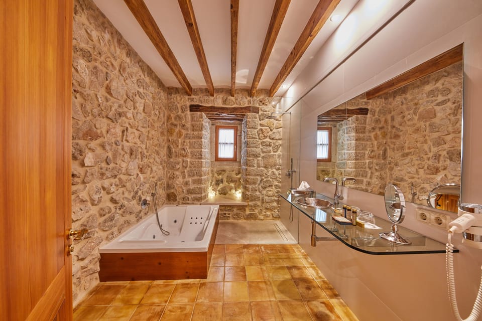 Separate tub and shower, designer toiletries, hair dryer, bathrobes