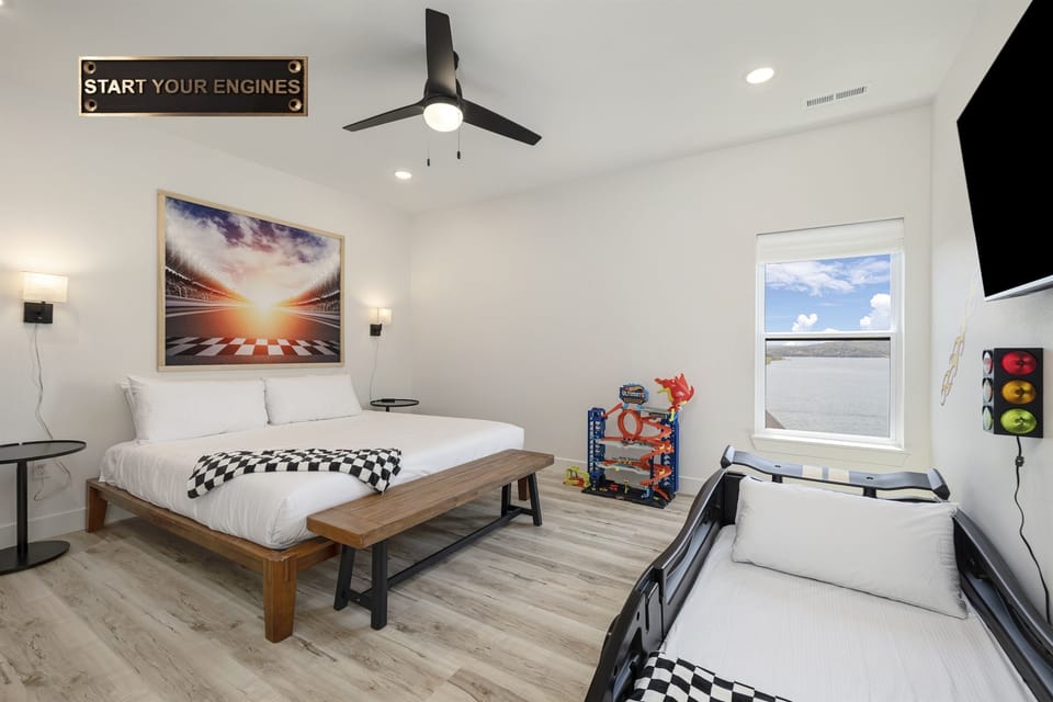 Sports Suite - Upper Level: Bedroom 8 w/ king bed, racer car twin bed, and ensuite bathroom