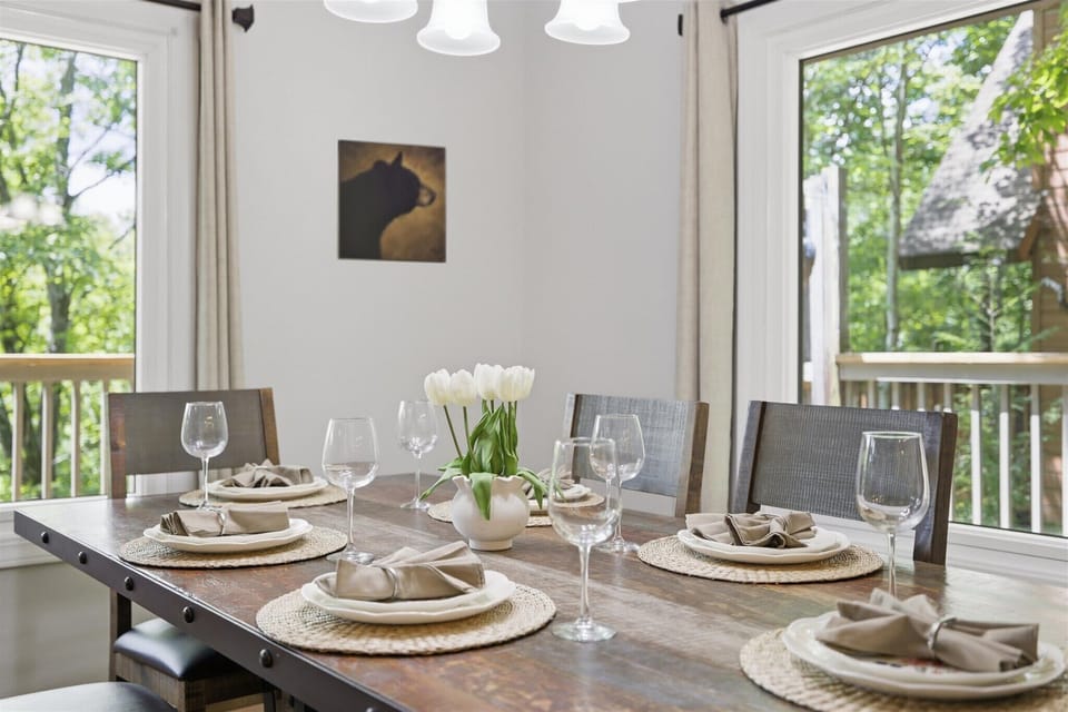 Enjoy nature views while feasting at this inviting table set for memorable gatherings!