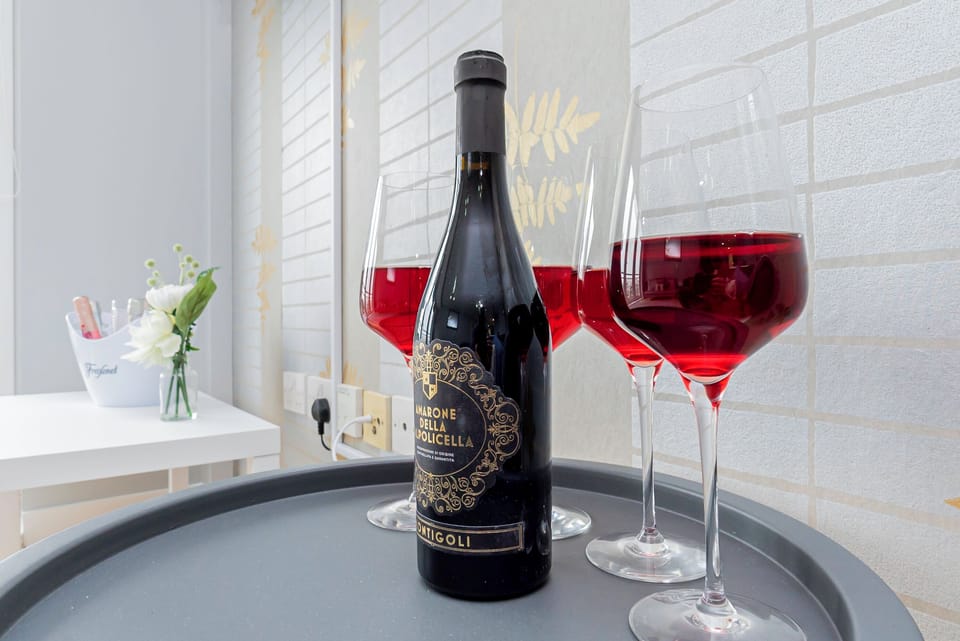 Elegant dining area, perfect for enjoying meals and sipping wine. A cozy space to unwind with a glass of your favorite drink, creating a relaxing ambiance for any occasion.