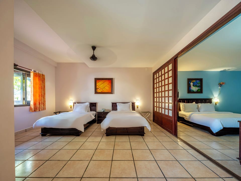Garden View Family Suite | 1 bedroom, premium bedding, pillowtop beds, minibar