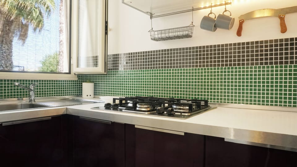 Apartment, Pool View | Private kitchen | Full-size fridge, stovetop, coffee/tea maker, electric kettle