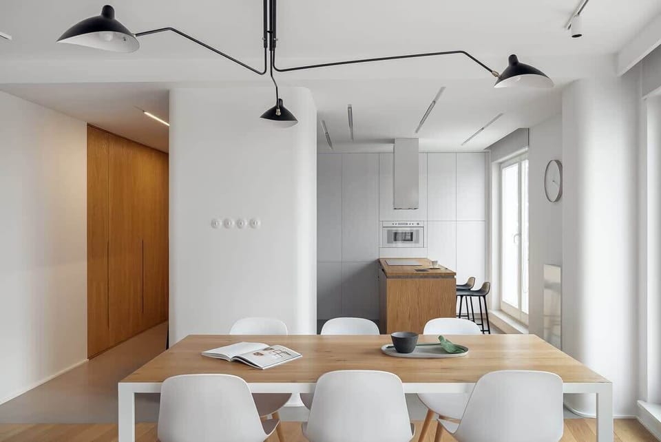 The sleek design of the kitchenette blending seamlessly with the living area.