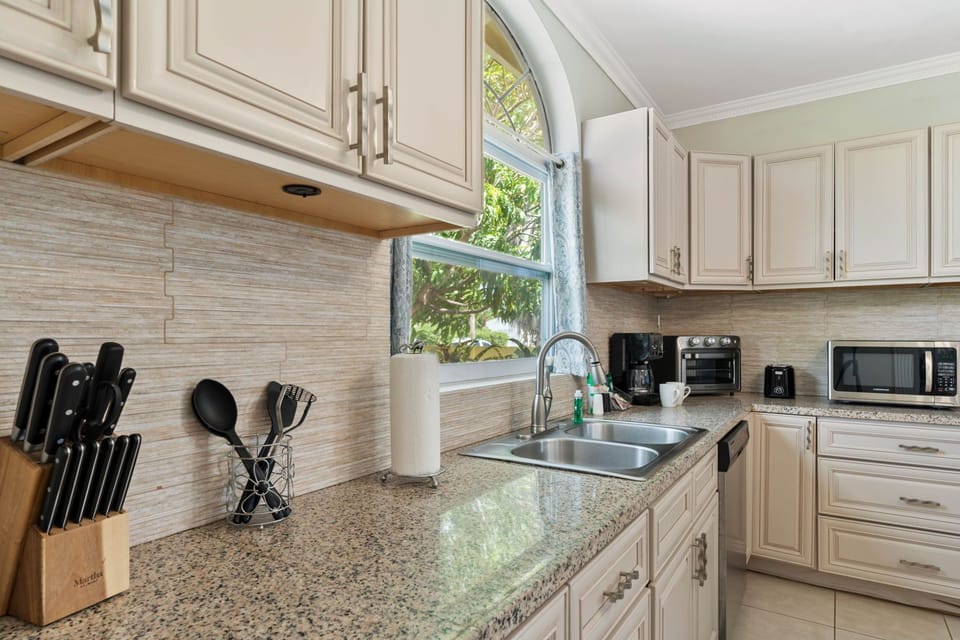 Experience the perfect harmony of cooking and dining in open concept kitchen and dining area of the home - Thoughtful placement of kitchen essentials for easy access and coordinated color palette for a cohesive look