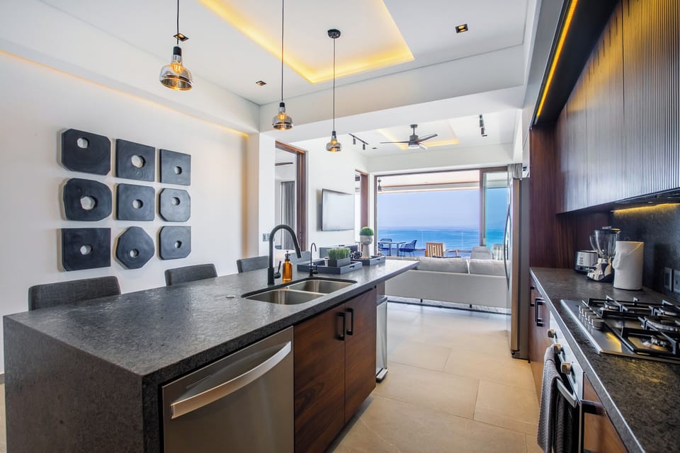 Kitchen amenities include a full-size fridge, stove, oven and dishwasher