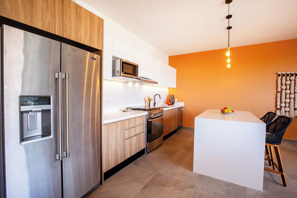 Kitchen amenities include a full-size fridge, stove, oven and dishwasher