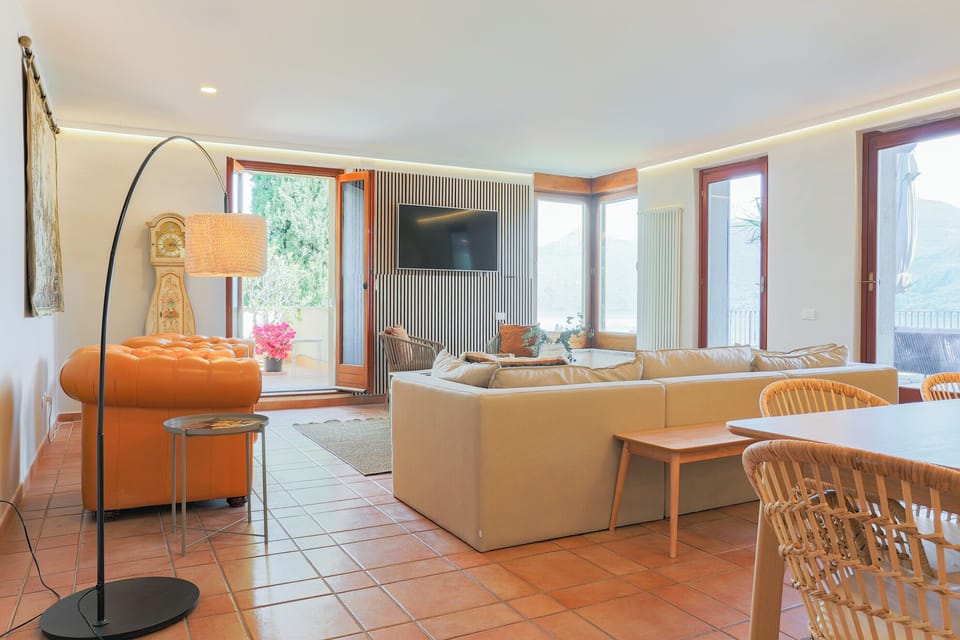 Apartment, Lake View | Living area | 30-inch TV with digital channels