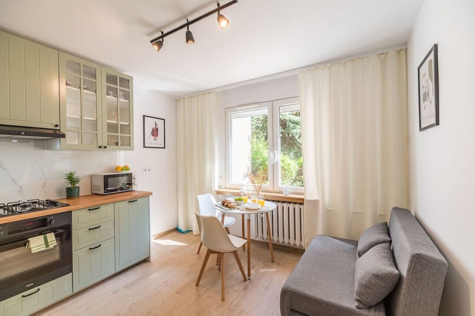 Comfortable Living Room with Sofa Bed and Smart TV | Book Now with RENTUJEMY