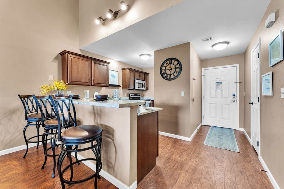 Large and modern kitchen well stocked with necessities to do meal prep. 