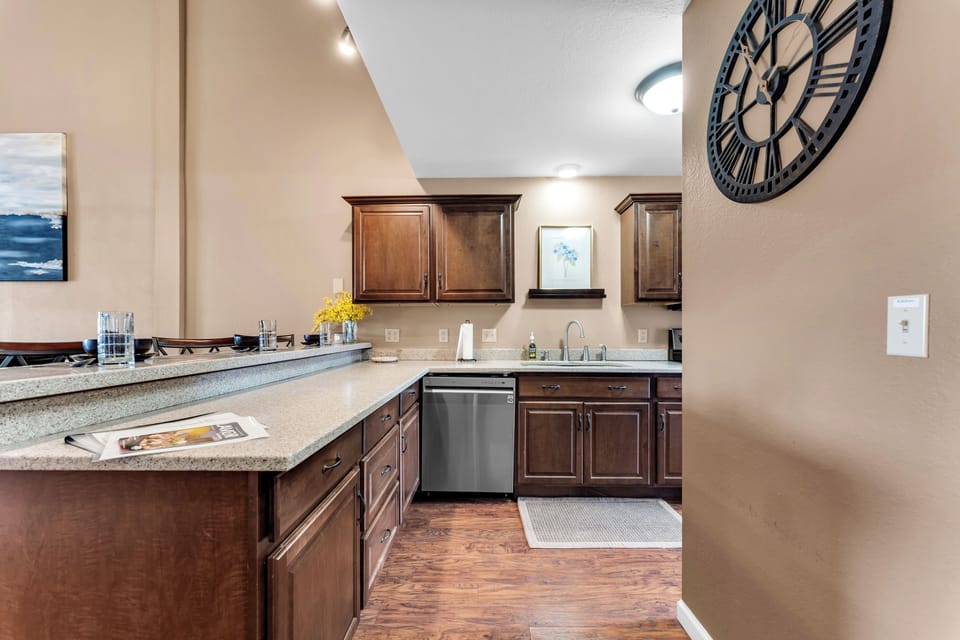 Large and modern kitchen well stocked with necessities to do meal prep. 