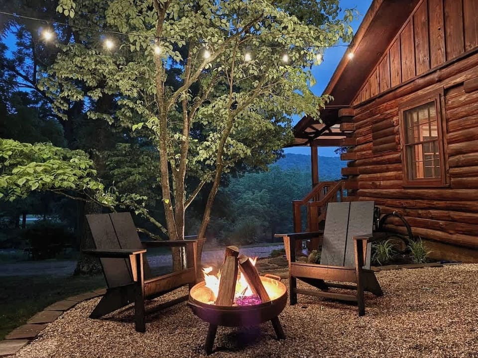 Outdoor patio with fire pit and grill. 
