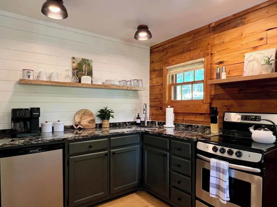 Full kitchen, mini fridge with freezer. Coffee, creamer, and sugar are provided. 