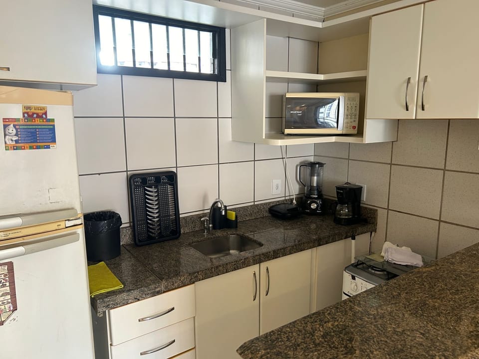 Basic Apartment, Lanai | Private kitchen | Microwave, oven, stovetop, toaster