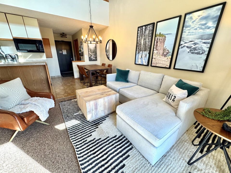 Living Room: Sun-soaked space with artful decor, perfect for relaxation and gathering!