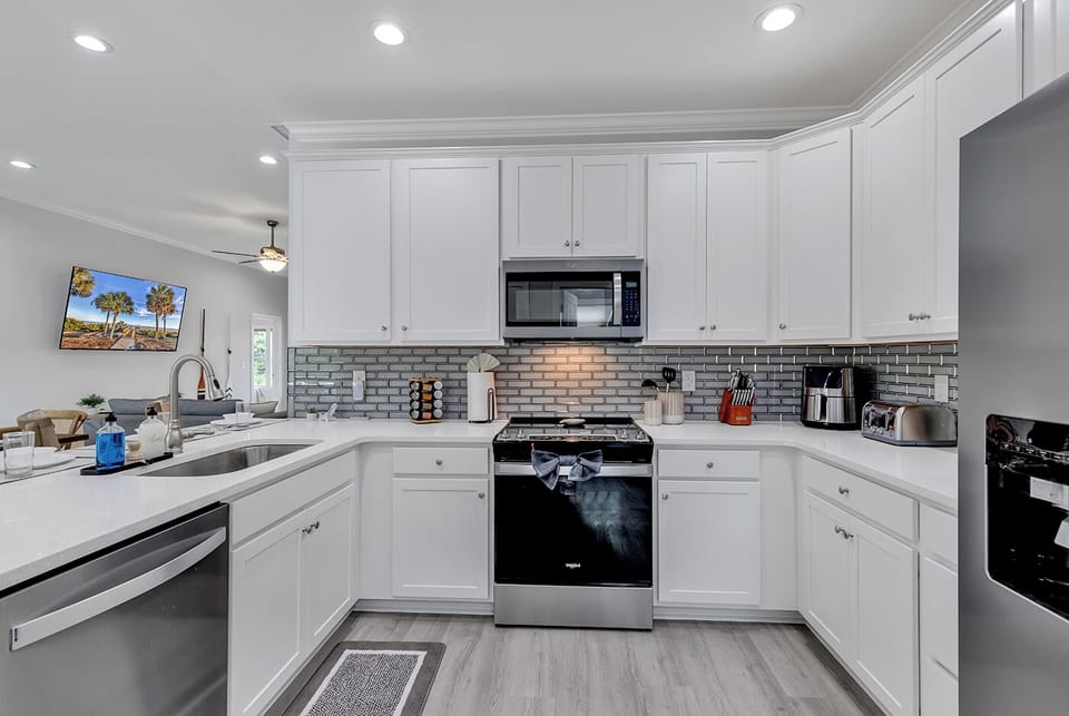 Welcome to our fully-equipped kitchen, where culinary adventures await. From morning coffees to gourmet dinners, every meal is a delight with all the essentials at your fingertips. Unleash your inner chef and savor the joy of cooking in this vibrant space.