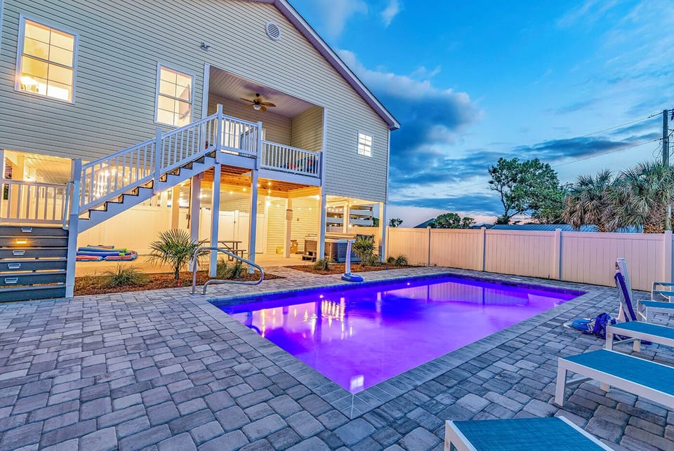 Dive into luxury with our sprawling 12x25 heated pool, aglow with mesmerizing LED lights. Experience the epitome of indulgence in your own backyard sanctuary. 🌟💦 #LuxuryLiving #PoolPerfection