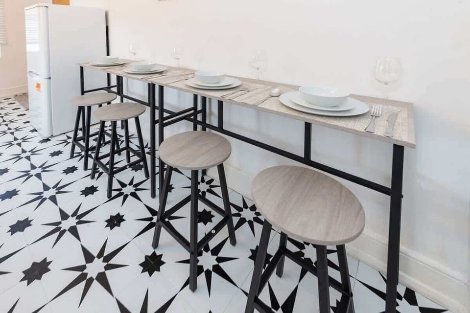 Breakfast bar with stools for two. Morning coffee, evening meal or laptop work. A proper spot to sit and eat without balancing a plate on your knee.