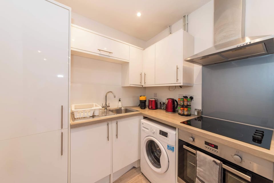 Kitchen with washer, oven, hob, microwave and kettle. Fully stocked with pots, pans, plates and cutlery. Cook real food, save real money.